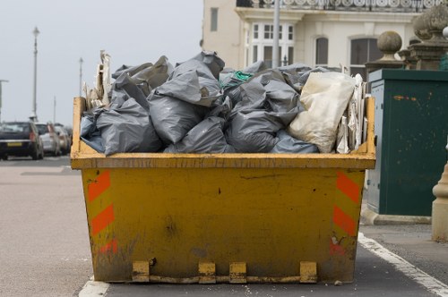 Modern waste disposal equipment and safety gear in Kingston Upon Thames